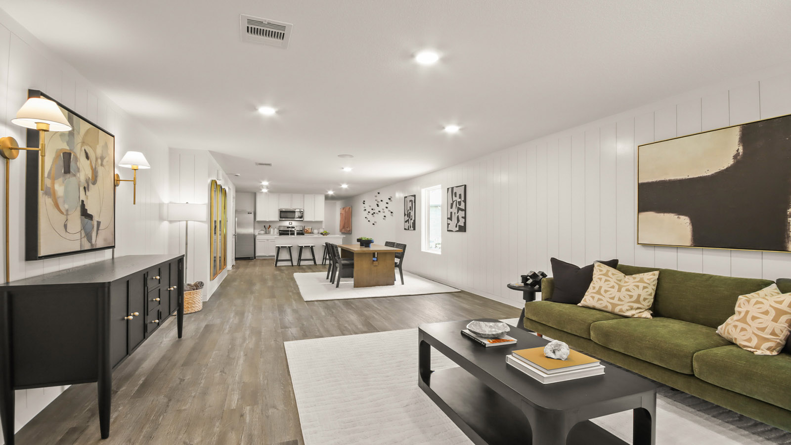 open concept living and dining with vinyl flooring