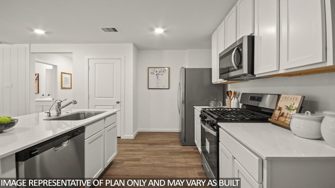 kitchen with stainless steel appliances and quartz countertops
