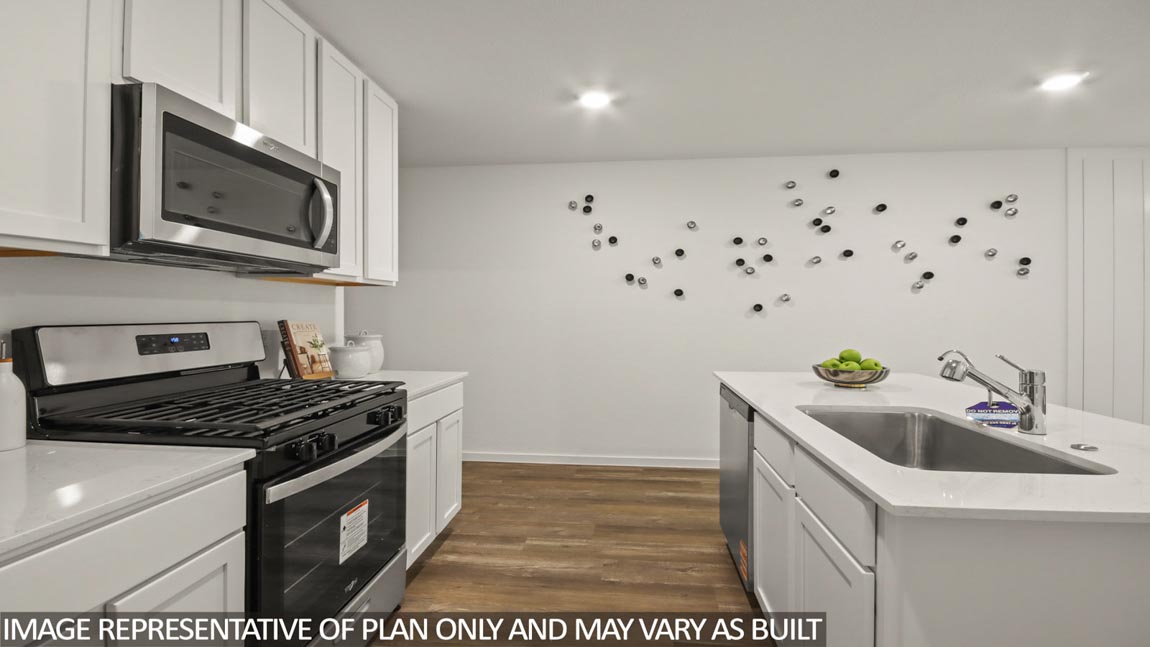 open concept living area with vinyl flooring, large windows, and quartz countertops