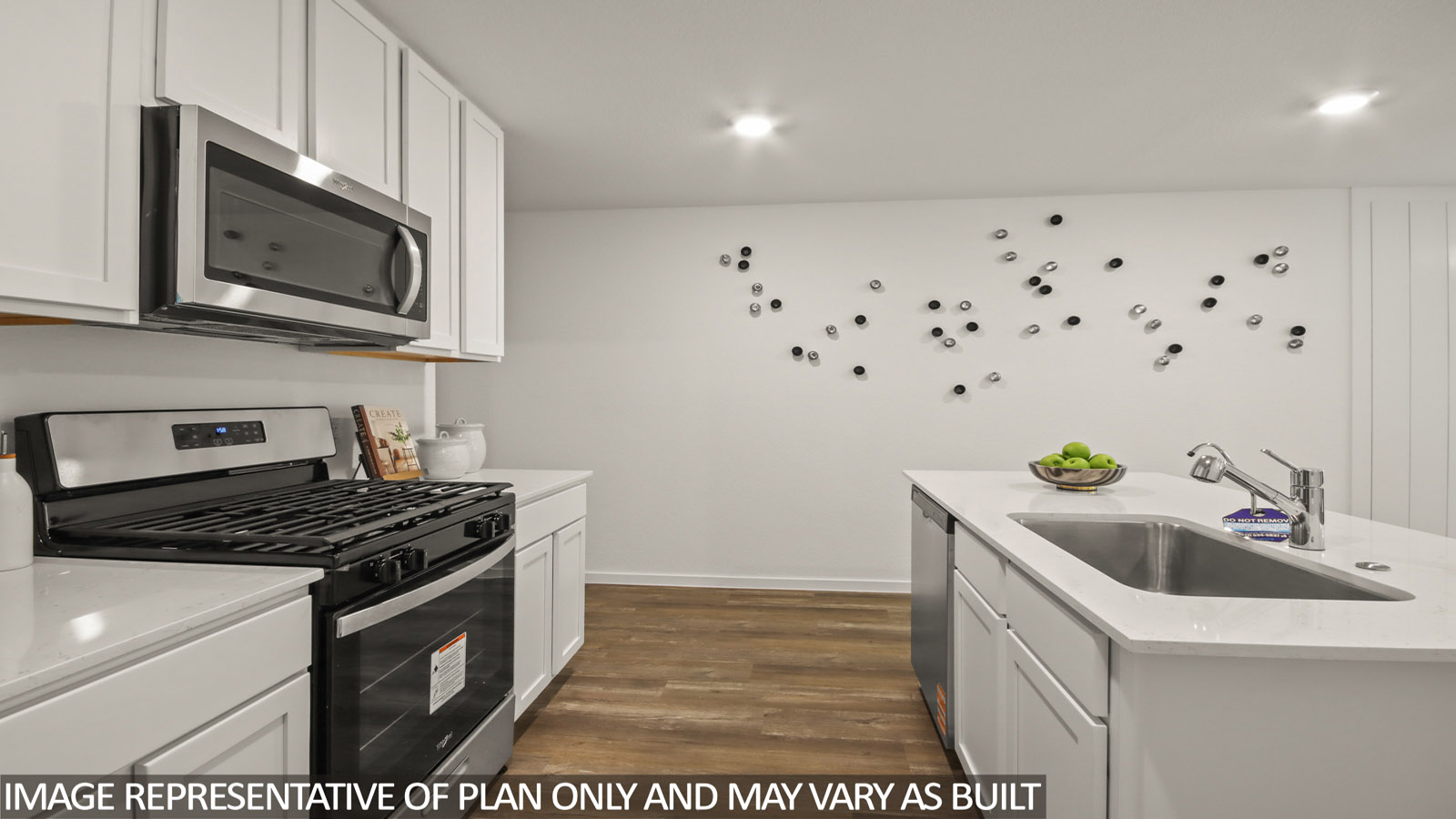 kitchen with quartz countertops, stainless steel appliances, and kitchen island