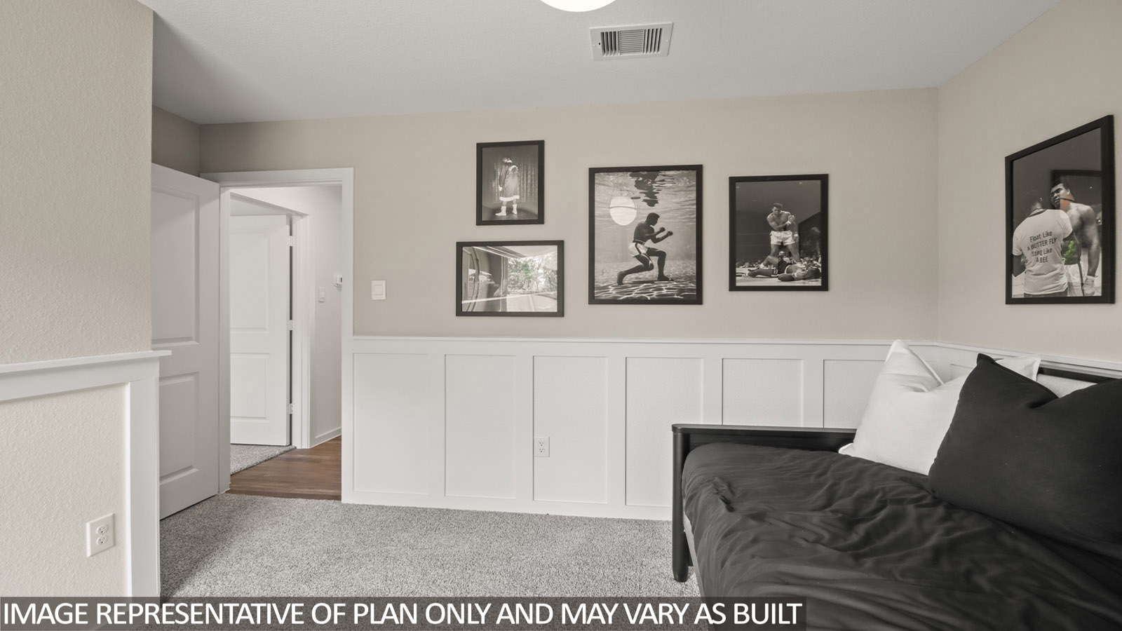 secondary bedoom with carpet flooring and window