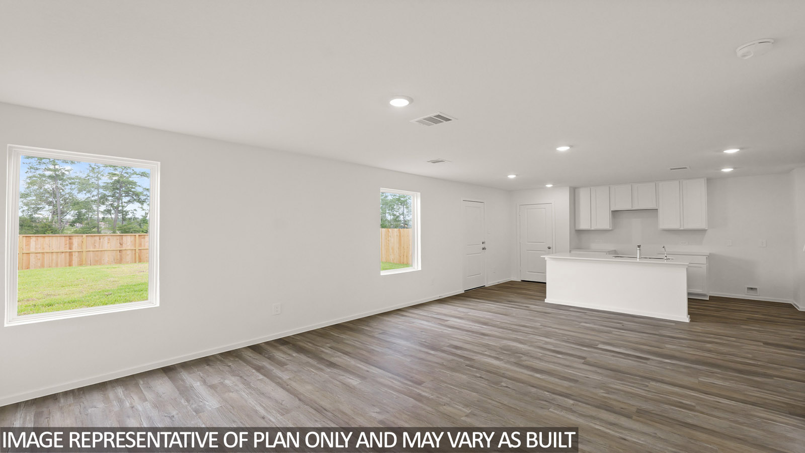 open concept livving and dining area with vinyl flooring, large windows, and quartz countertops