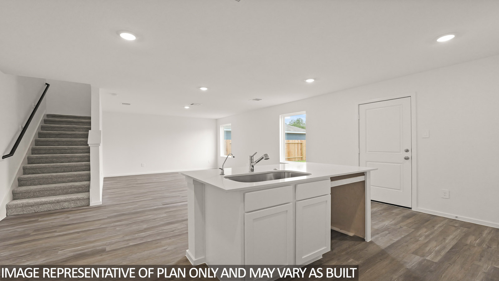 open concept living and dining area with vinyl flooring, large windows, quartz countertops in Hockley, TX