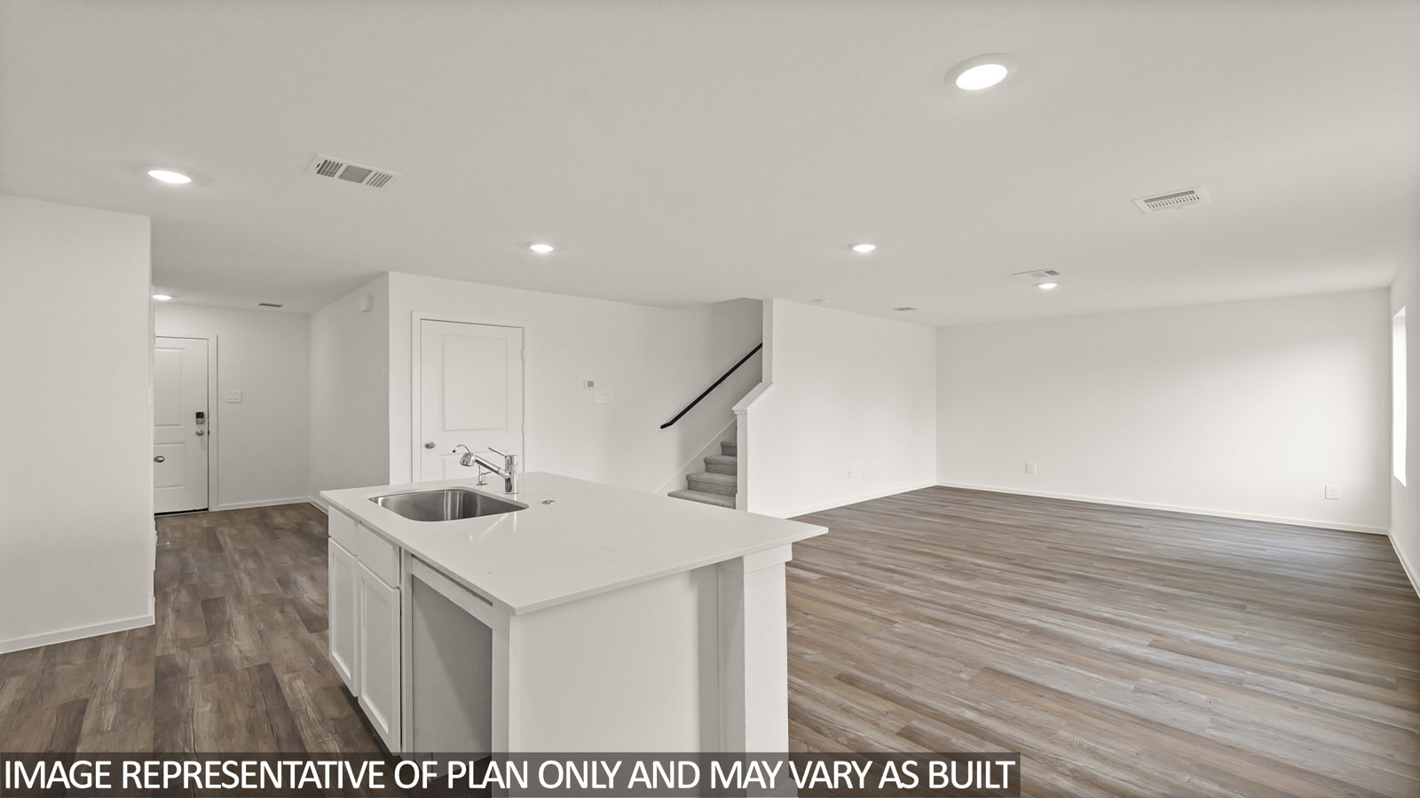 open concept living and dining area with vinyl flooring, large windows, quartz countertops in Hockley, TX