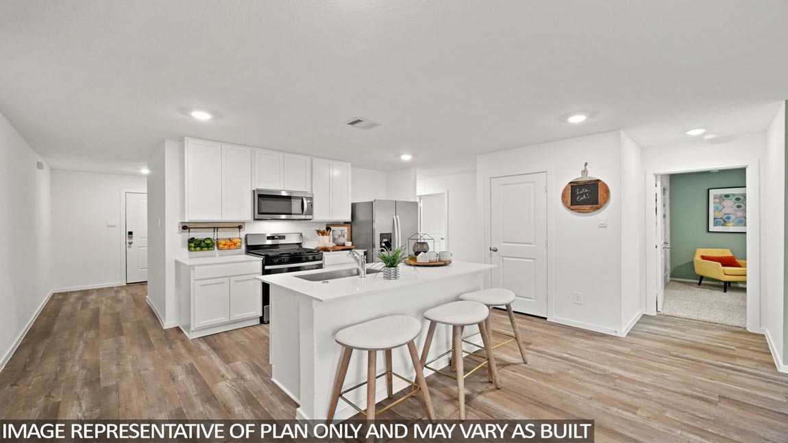open concept living and dining area with vinyl flooring, quartz countertops, and large windows