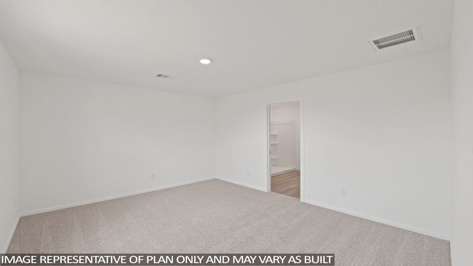 Primary bedroom with carpet flooring