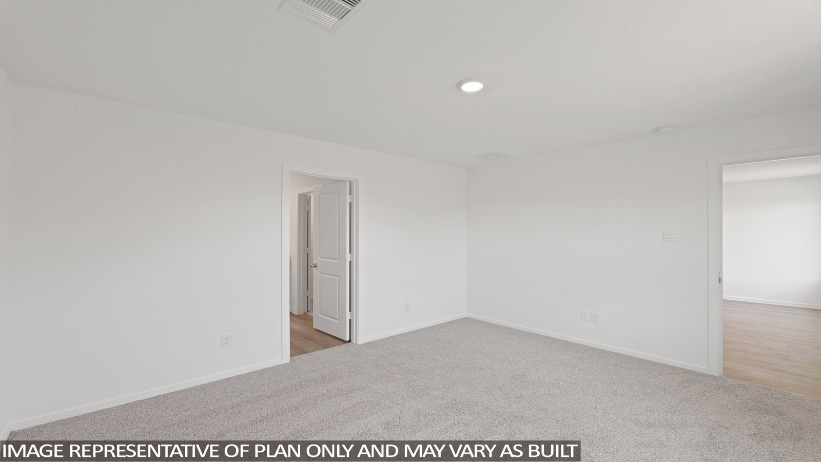 Primary bedroom with carpet flooring