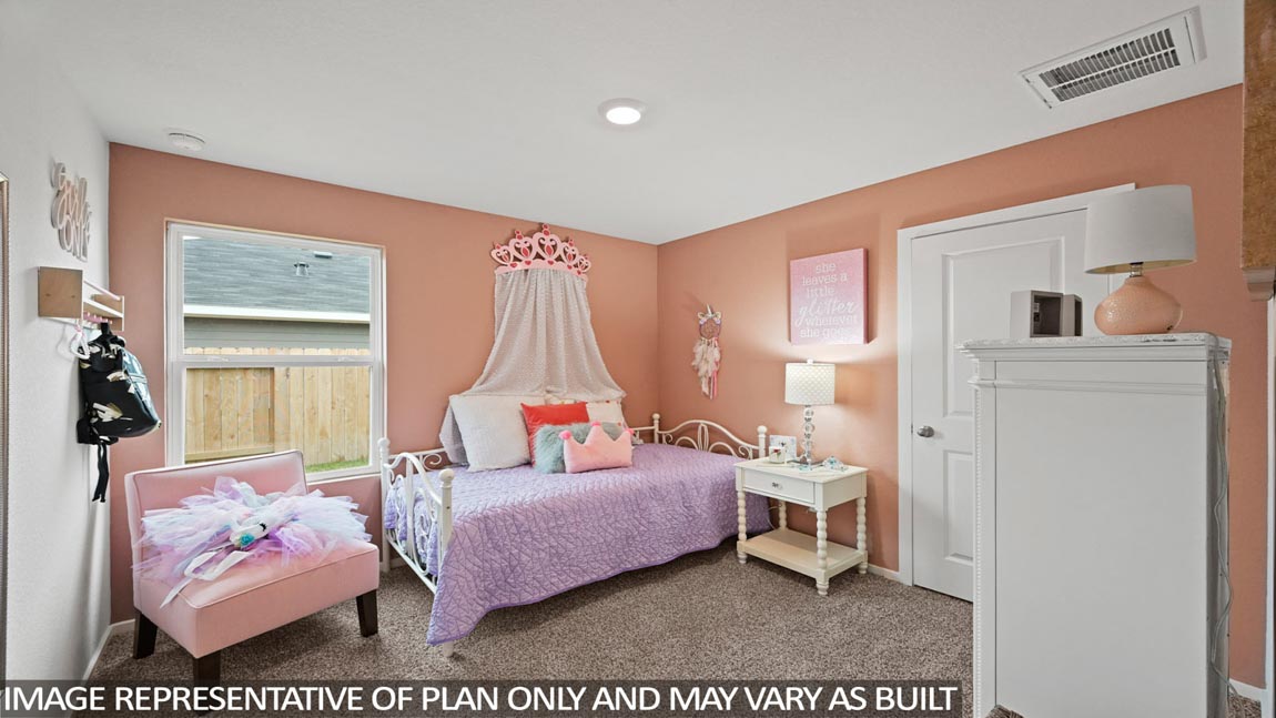 Secondary bedroom with shag carpet flooring and bright window