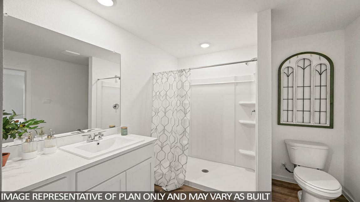 Primary bathroom with stand-alone shower with tiles and semi frameless glass in Hockley TX