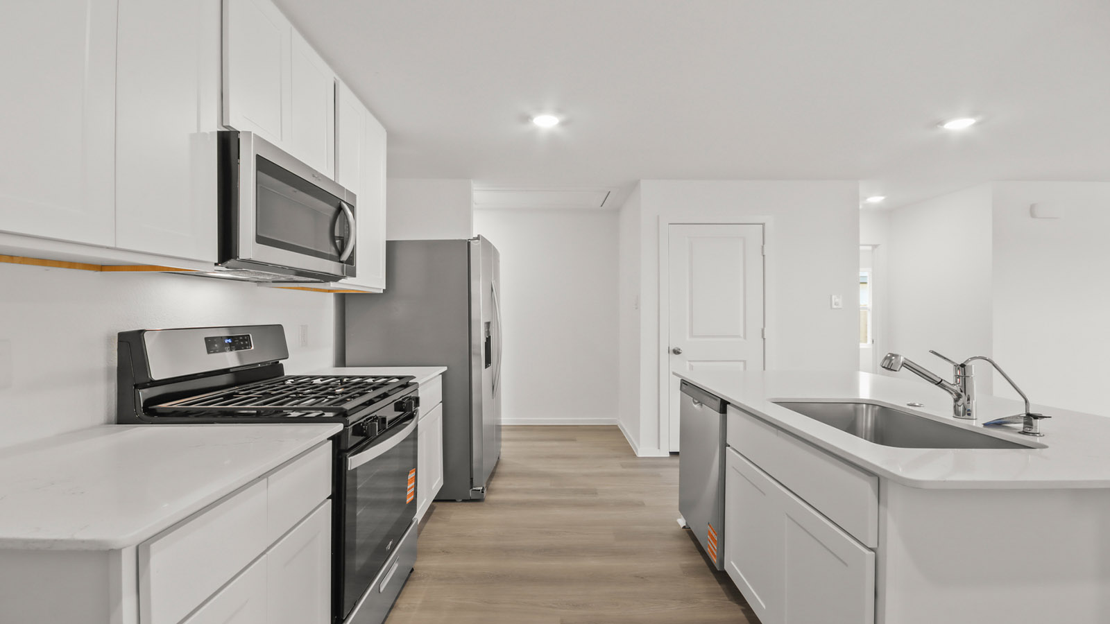 open concept living and dining area with vinyl flooring and large windows