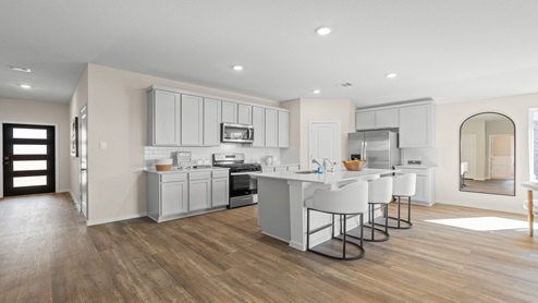 open concept living and fining room with vinyl flooring