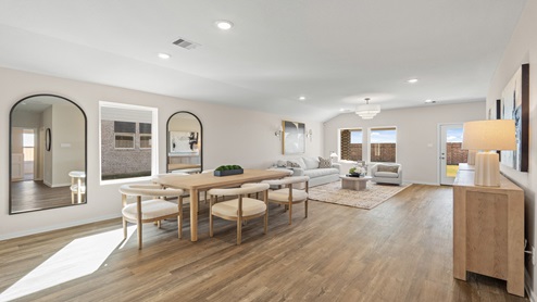 open concept living and fining room with vinyl flooring