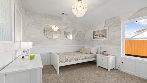 secondary bedroom with carpet and window