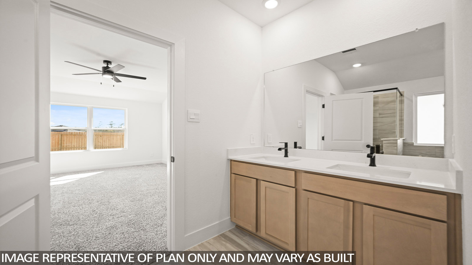 Primary bathroom with double sinks with quartz counter tops in Katy TX