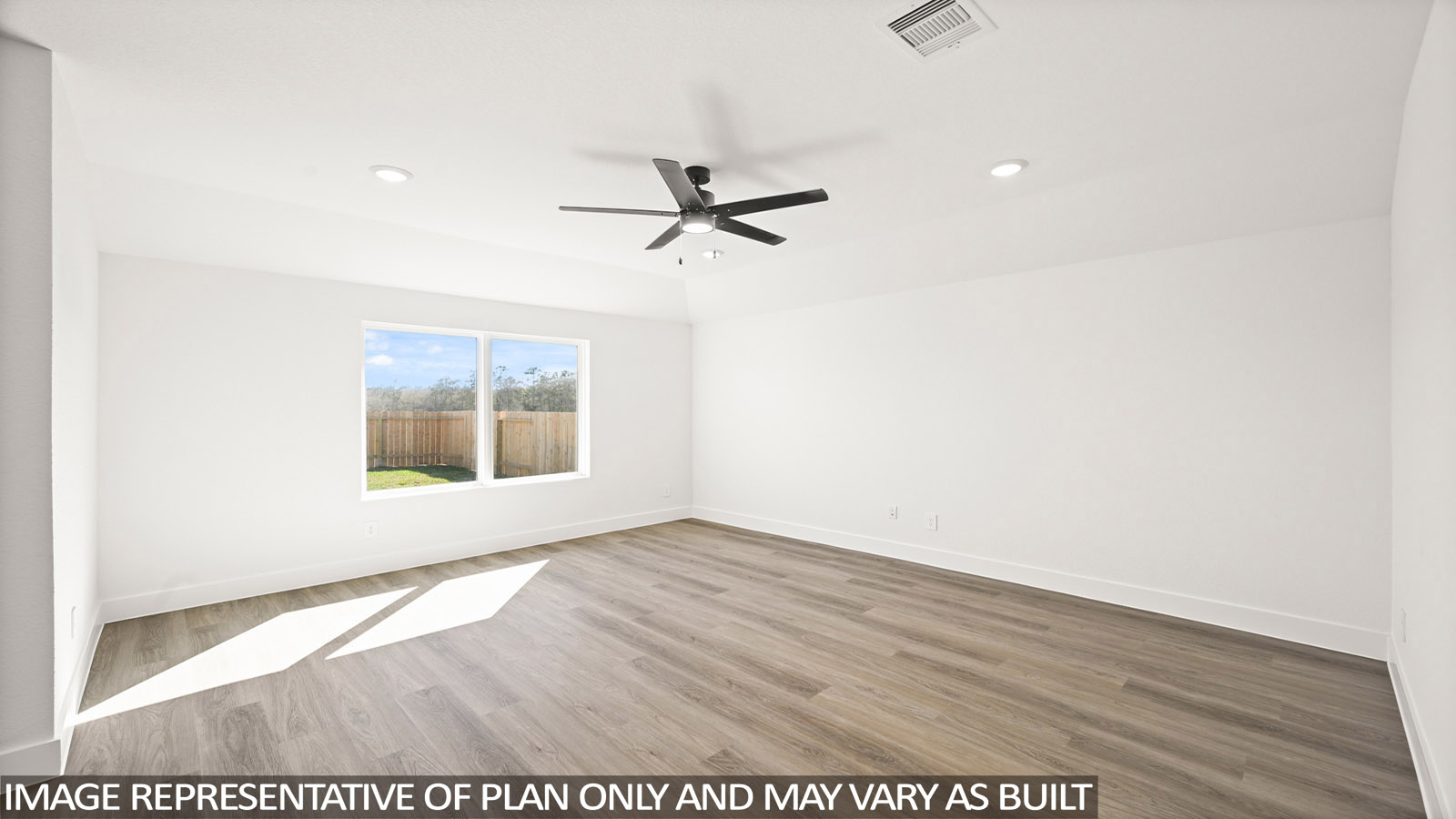 Spacious living area with vinyl flooring