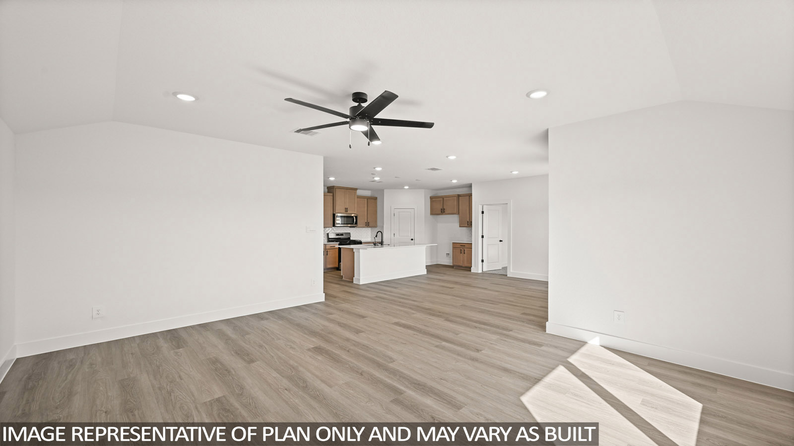 Spacious living area with vinyl flooring