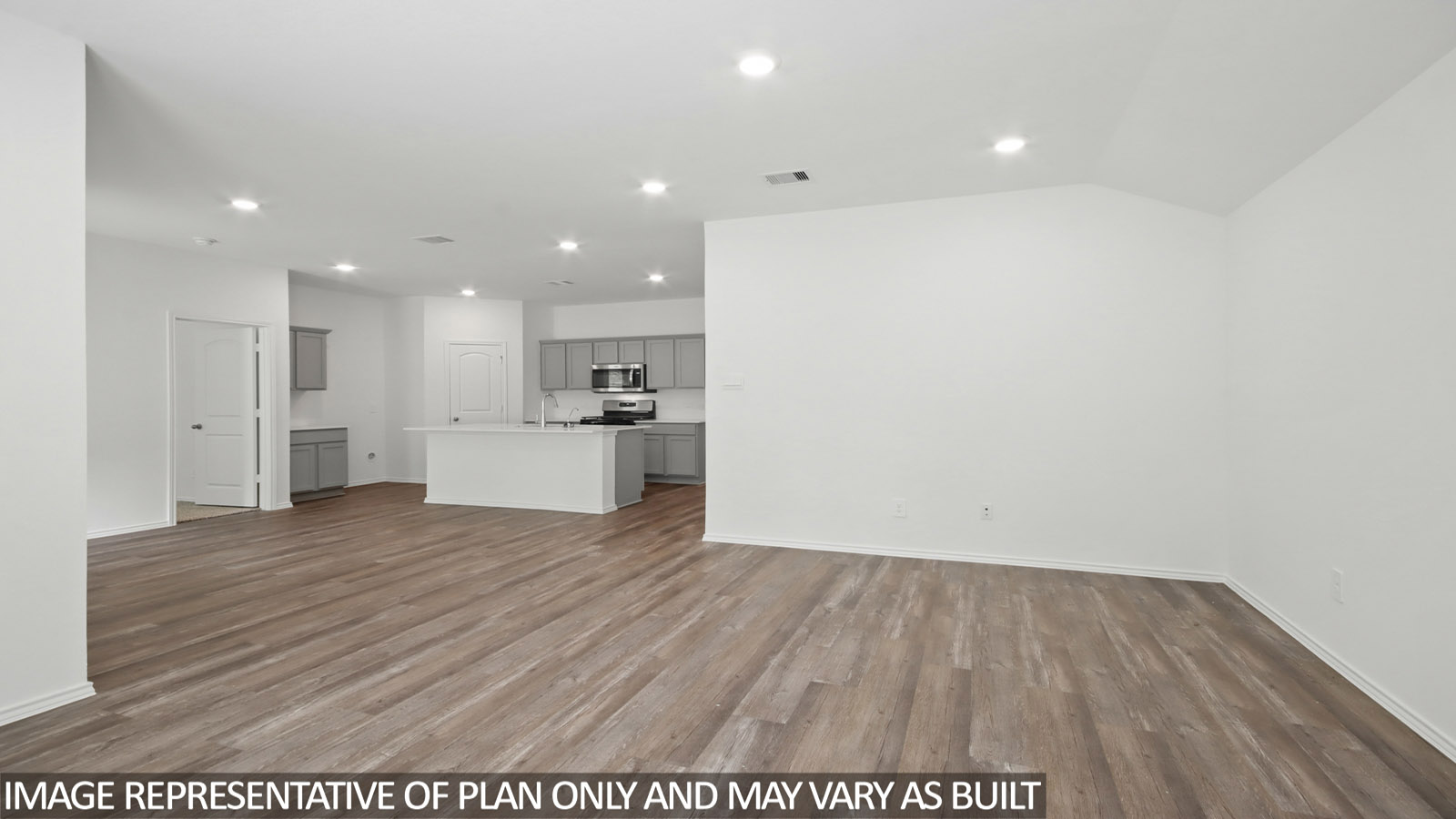 Living room looking to kitchen, dining, outdoor areas in this new home features natural light, with fresh open concept flow
