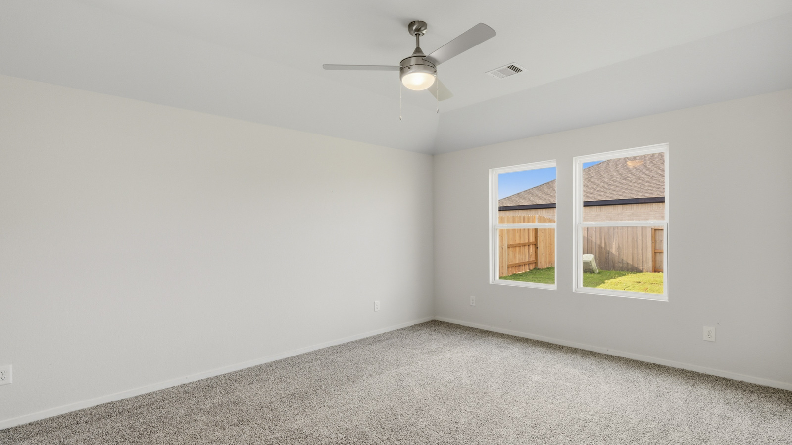 bedroom with carpet flooring and windows