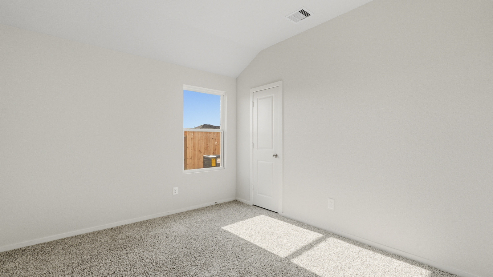 bedroom with carpet flooring and windows