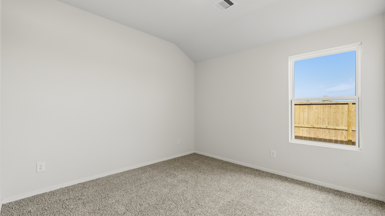 bedroom with carpet flooring and windows