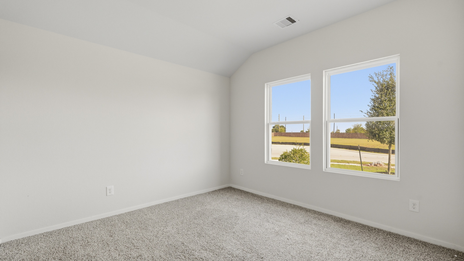 bedroom with carpet flooring and windows