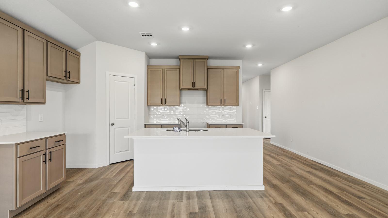 kitchen with quartz countertops and stainless steel appliances in Brookshire, TX