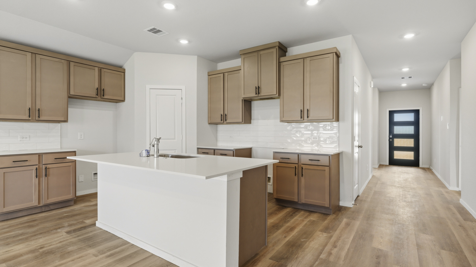 kitchen with quartz countertops and stainless steel appliances in Brookshire, TX