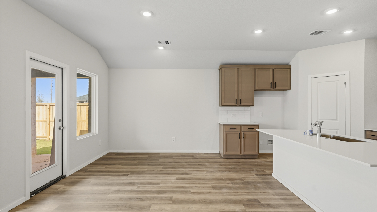 kitchen with quartz countertops and stainless steel appliances in Brookshire, TX