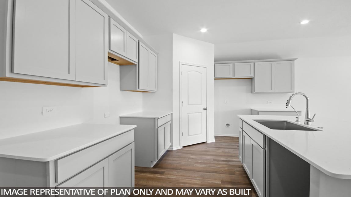 kitchen with quartz countertops and stainless steel appliances in Brookshire, TX