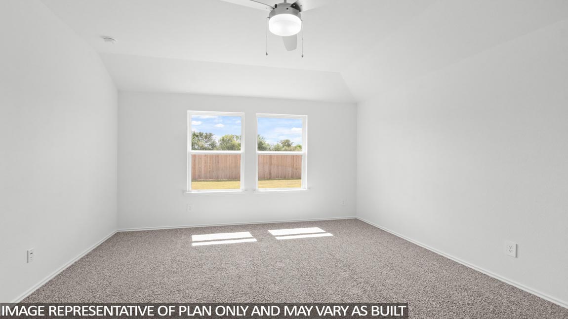 bedroom with carpet flooring and windows