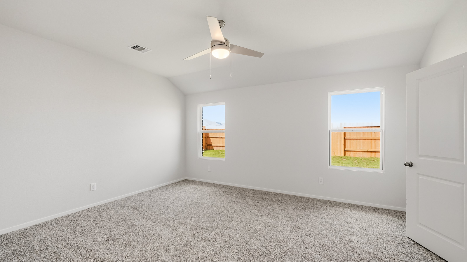 bedroom with carpet flooring and windows