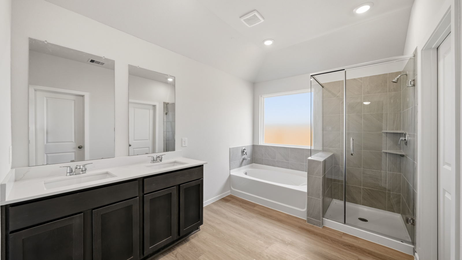 Primary bathroom with separate tub and shower