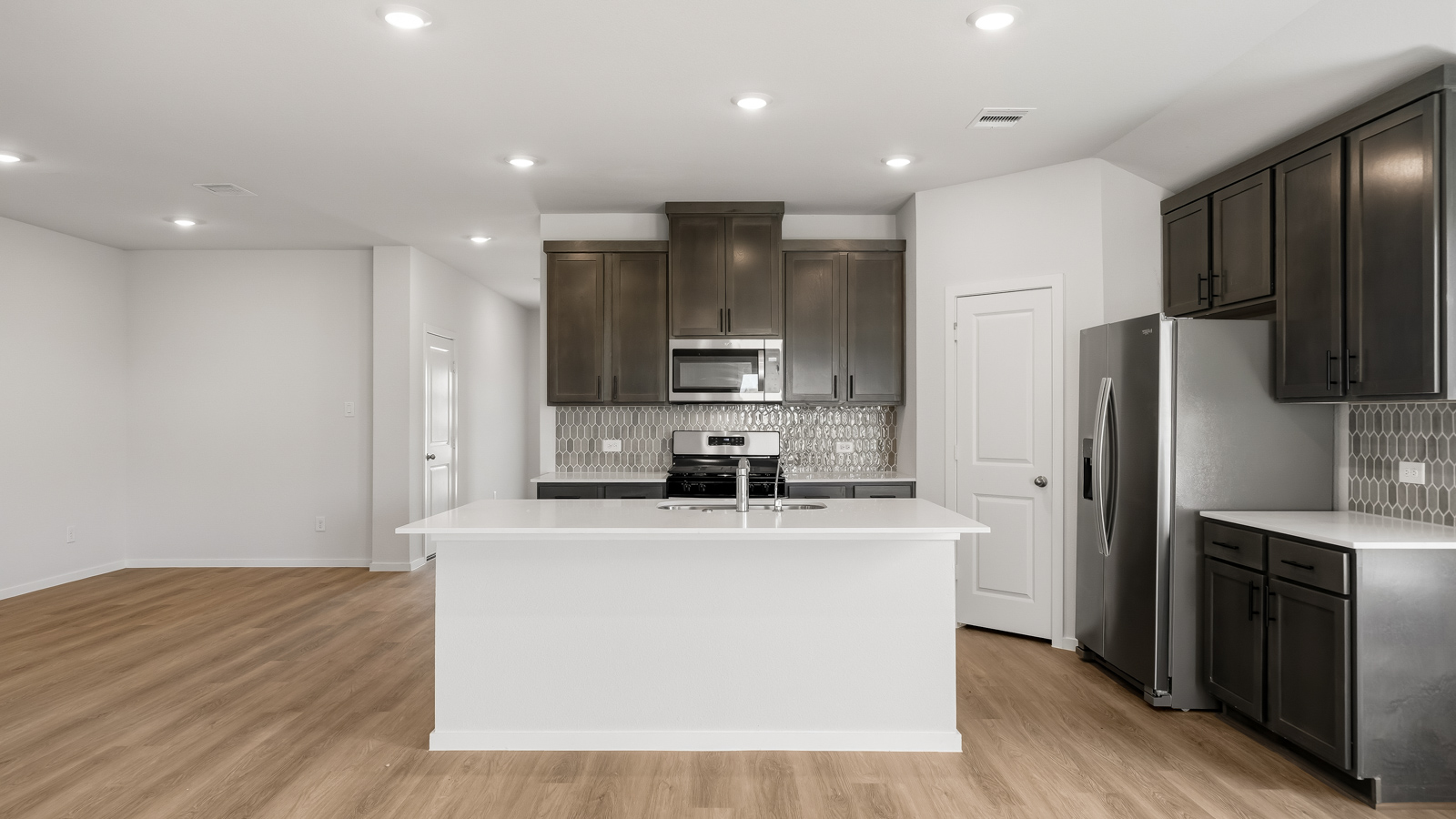 kitchen with quartz countertops, and stainless steel appliances in Brookshire, TX