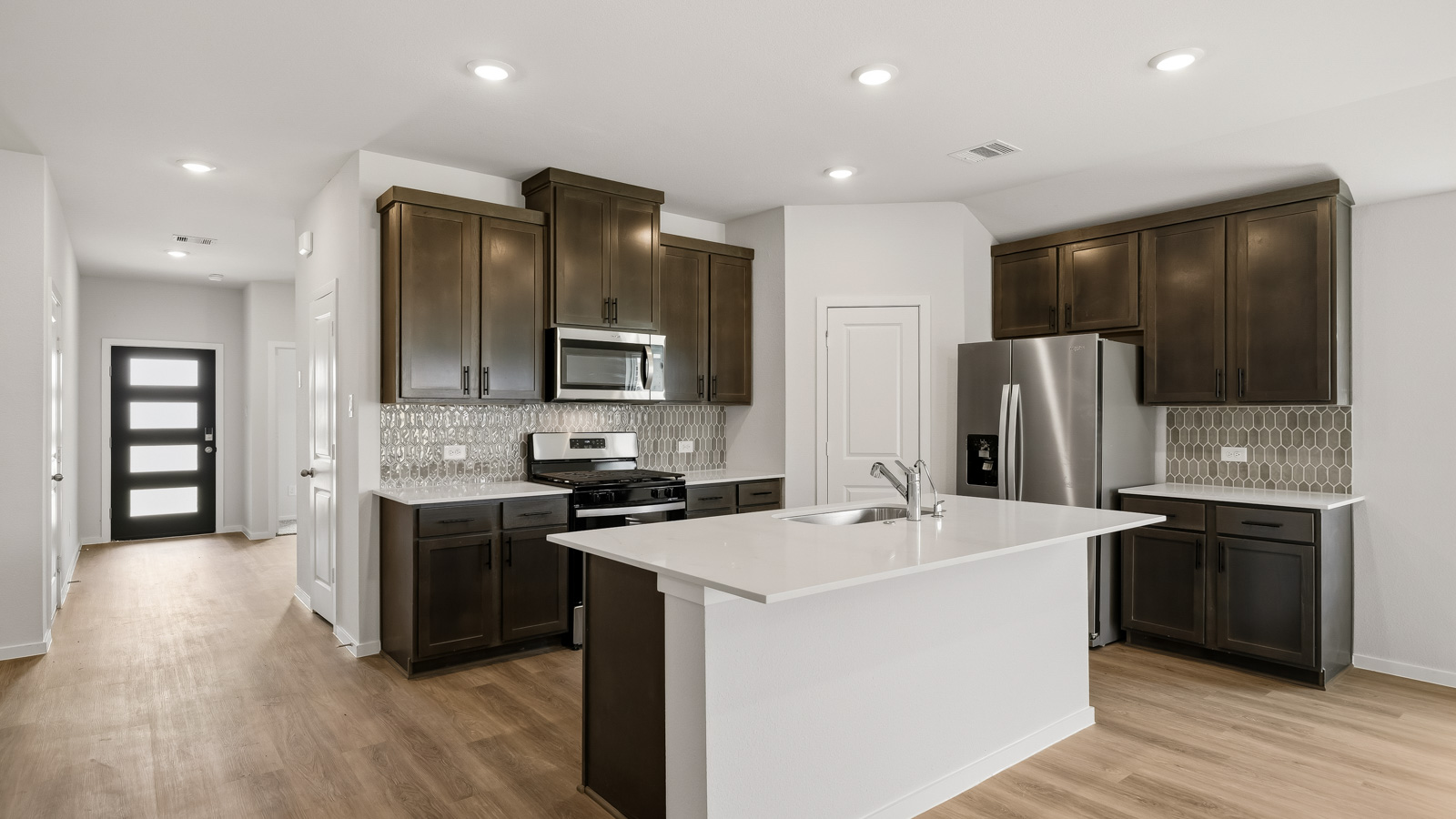 kitchen with quartz countertops, and stainless steel appliances in Brookshire, TX