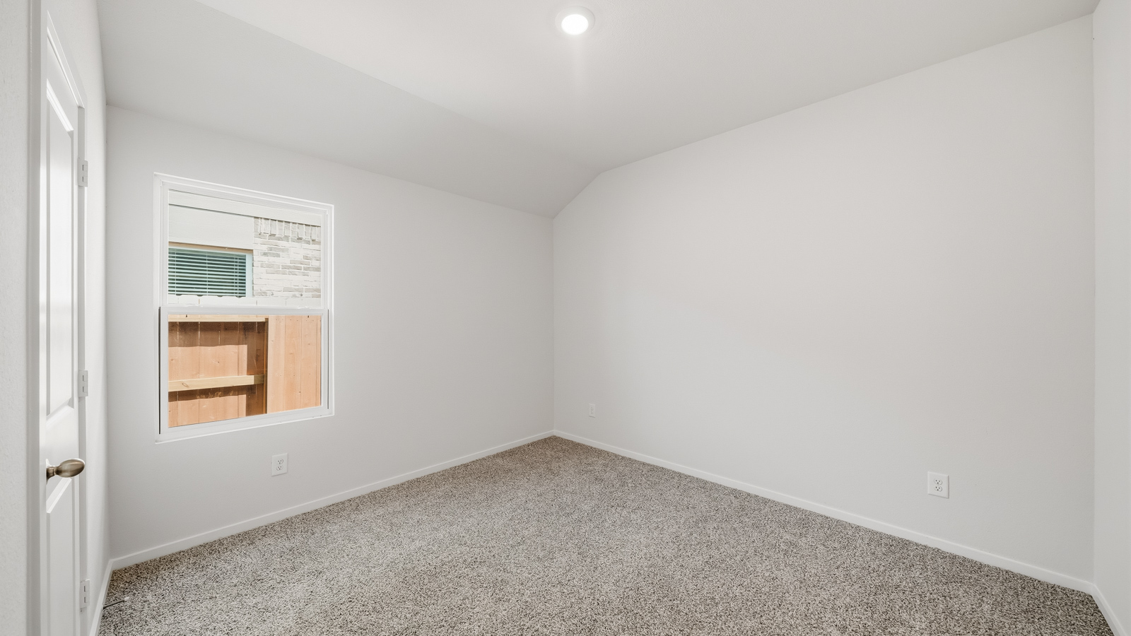 bedroom with carpet flooring and windows