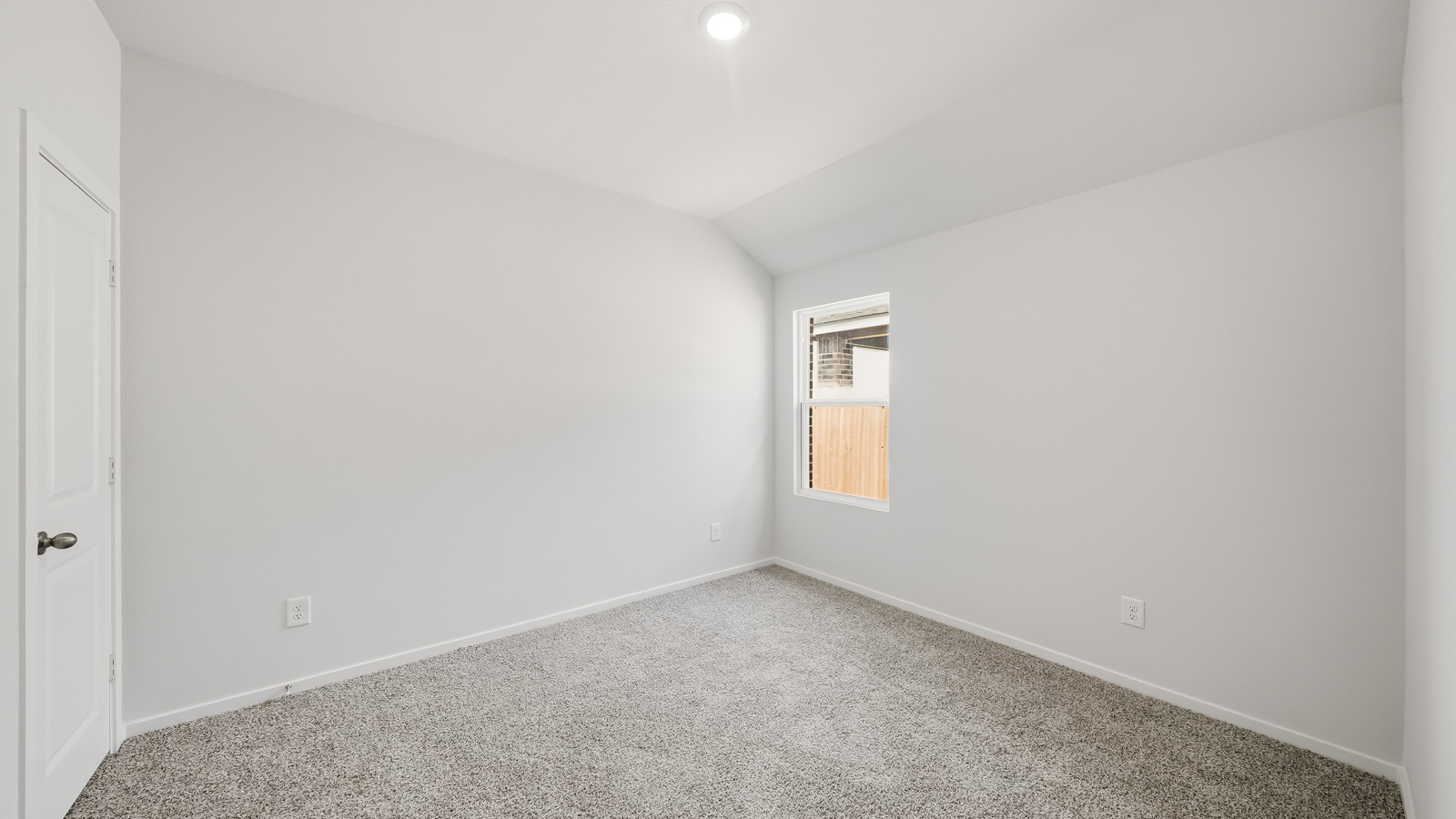 bedroom with carpet flooring and windows