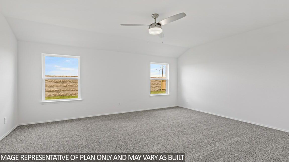 bedroom with carpet flooring and windows
