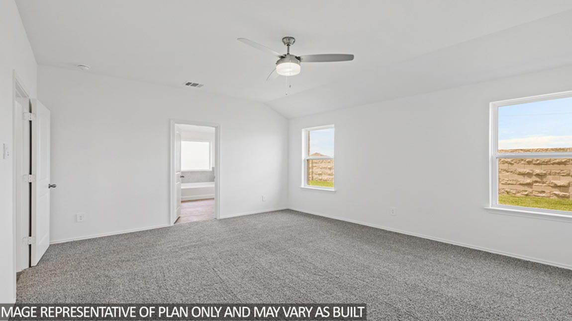bedroom with carpet flooring and windows
