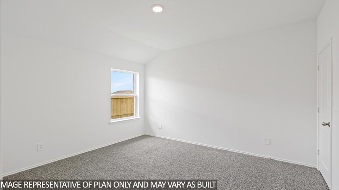 bedroom with carpet flooring and windows