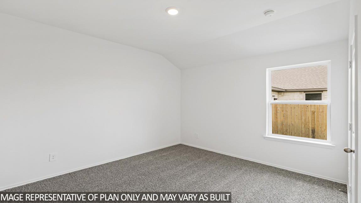 bedroom with carpet flooring and windows