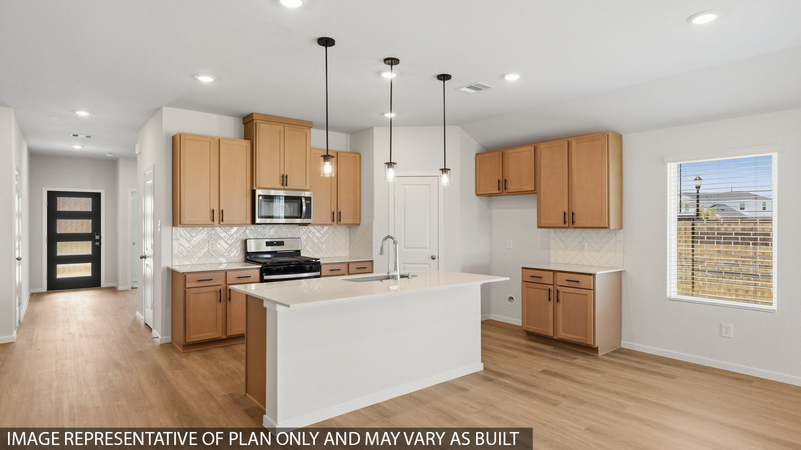 kitchen with backsplash, quartz countertops, and pendant lightings