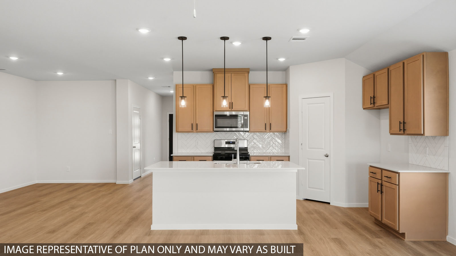 kitchen with backsplash, quartz countertops, and pendant lightings