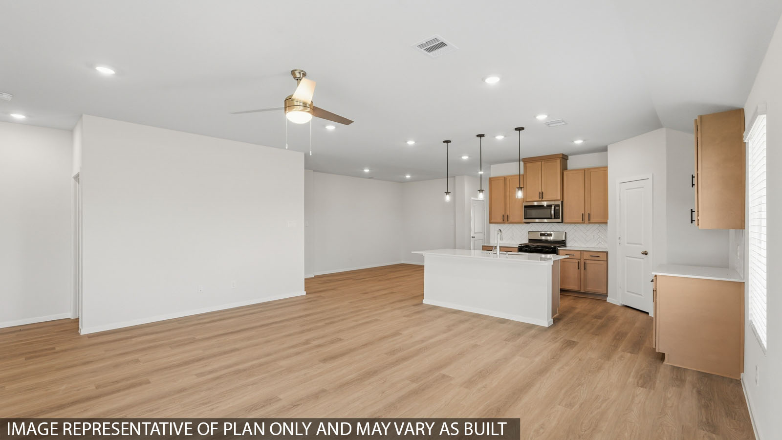 open concept living and dining area with vinyl flooring