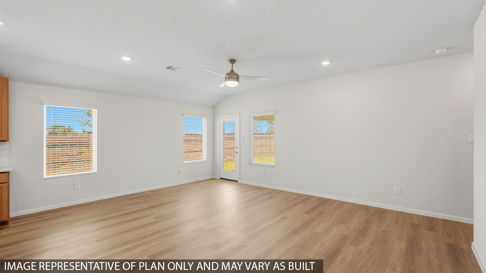 open concept living and dining area with vinyl flooring