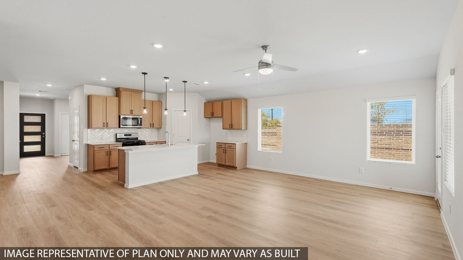 open concept living and dining area with vinyl flooring
