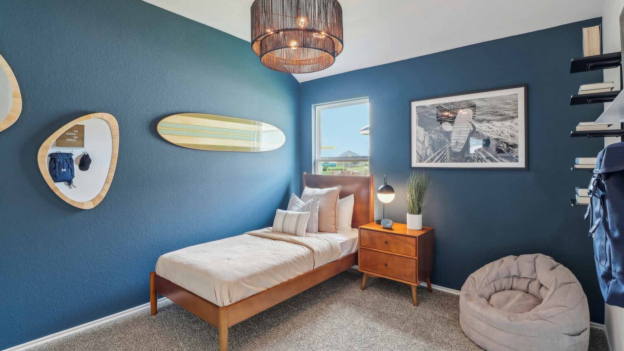 Secondary bedroom with shag carpet flooring and bright window