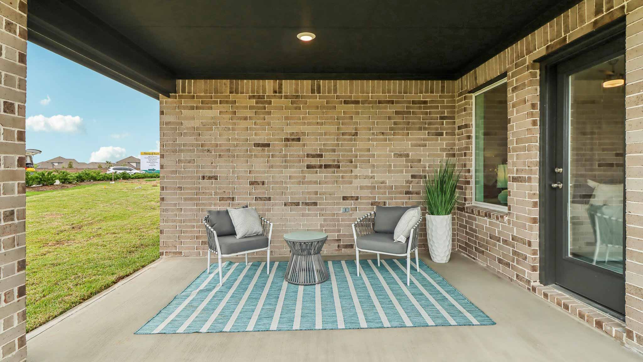 covered patio with jamies hardie siding and overhead lighting