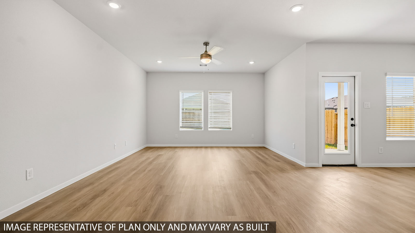 open concept living and dinig area with vinyl flooring and large windows