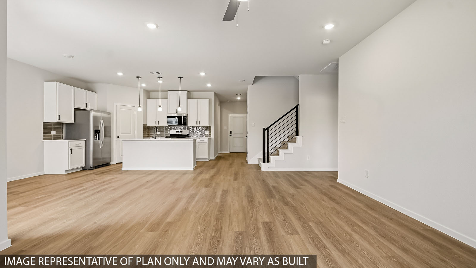 open concept living and dinig area with vinyl flooring and large windows