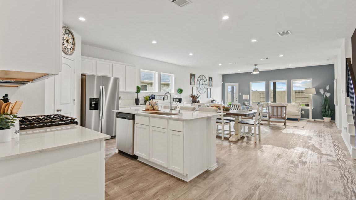open concept living and dining area with vinyl flooring